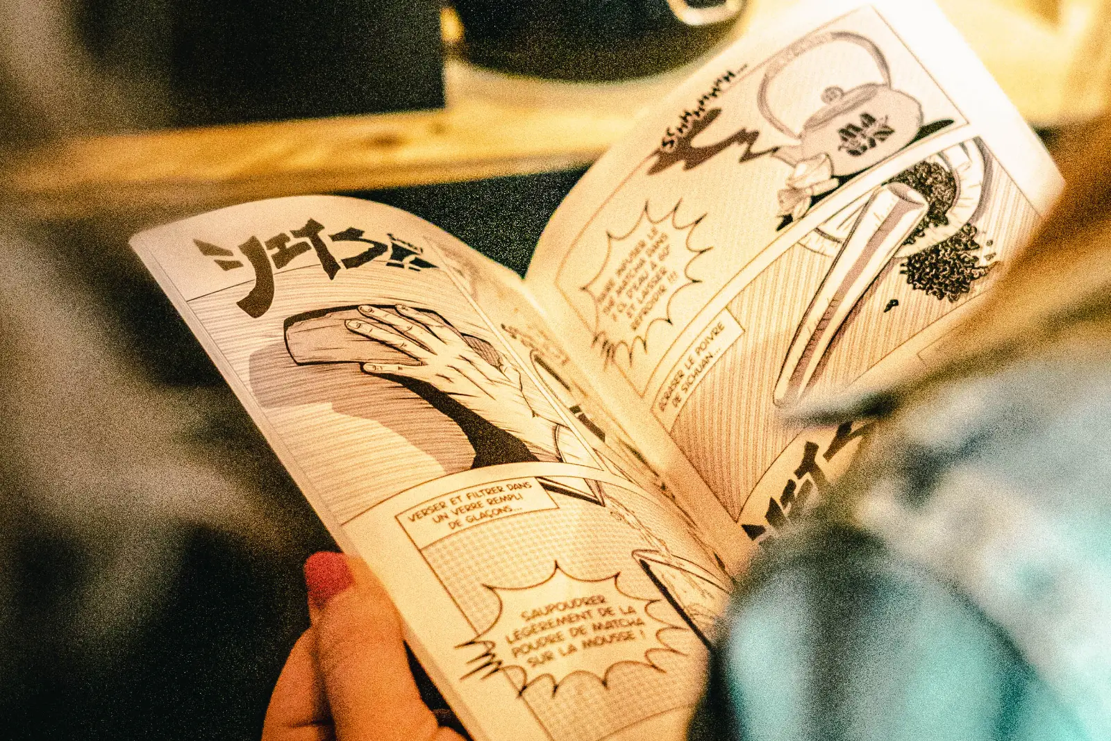 The MaGin Les Recettes manga open on a matcha cocktail recipe